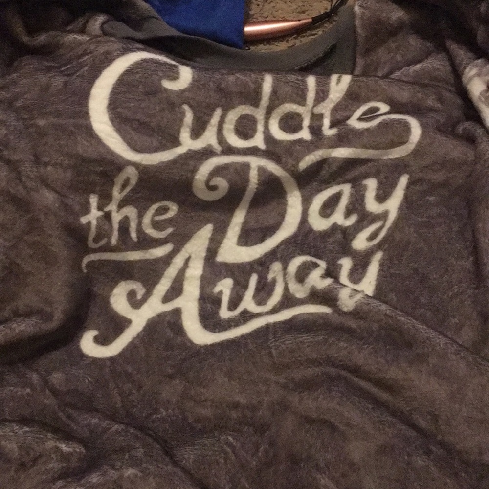 Sweater with cuddle my day away on it